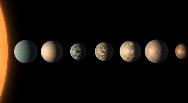 slide 3 - This artist's concept shows what the TRAPPIST-1 planetary system