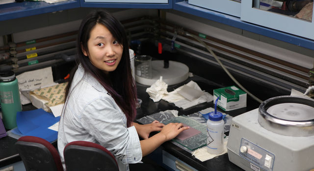 A JPL intern works in the lab