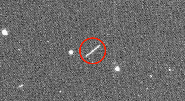 The circled streak in the center of this image is asteroid 2020 QG