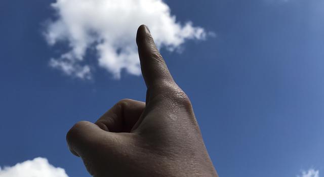 Puffy clouds in a bright blue sky