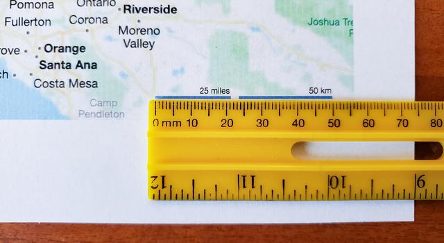 A ruler is shown beside the scale on a printed out map