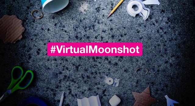 Scissors, cups, a pencil and other materials scattered on the ground. A text overlay reads #VirtualMoonshot