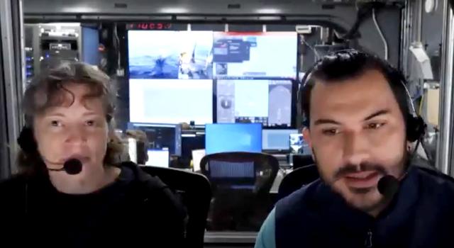 Two people wearing headsets do a webinar from aboard a ship.