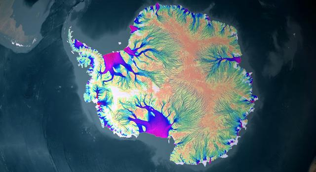 Colorful vein-like structures showing the movement of ice across Antarctica are overlaid on a satellite image of the continent.
