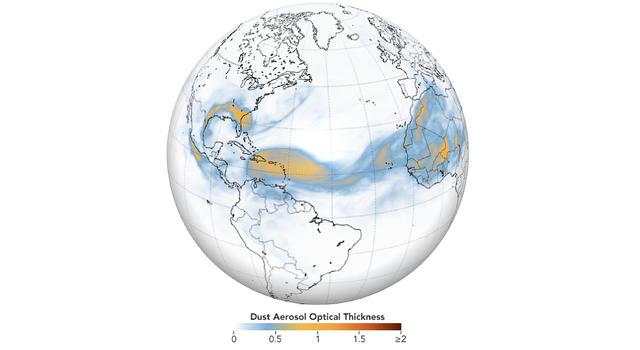 A data map overlaid on the globe shows thick swirls of dust traveling from West Africa, across the Atlantic Ocean and all the way to the Caribbean and Southern U.S.